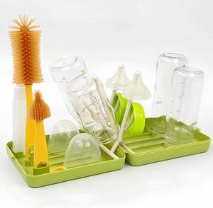 lot 50443 image: MOMMED Travel Bottle Brush, 6 in 1 Travel Bottle Cleaner Kit with Silicone Bottle BrushNipple BrushStraw BrushSoap DispenserStorageBottle Drying Rack,Portable Baby Essentials Kit for Travel Green