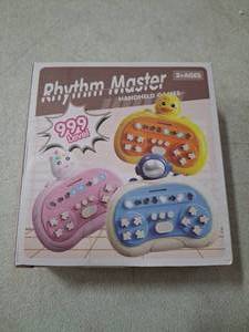 lot 55006 image: Rhythm Master Handheld Game System, 999 Levels