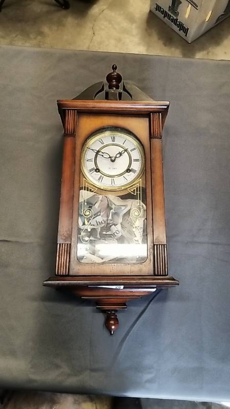 lot 26 image: 31 Day Wall Clock- Wood   Very Pretty and Works- Key Included-  25 tall, 8 12 wide, and 5 deep