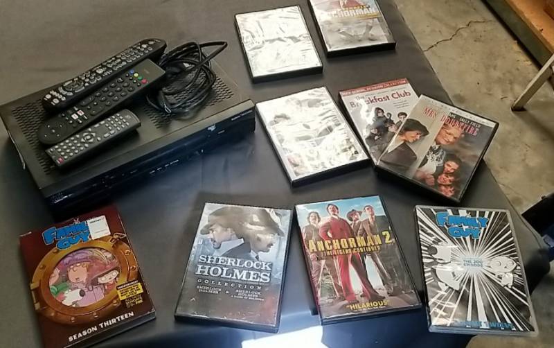 lot 29 image: CableSatellite Box- Remotes and DVD Lot