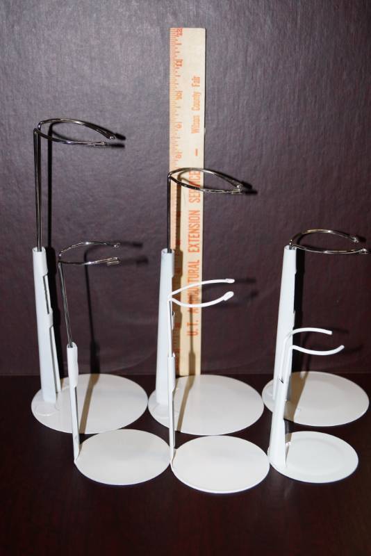 lot 511 image: 6 Adjustable Doll Stands  3 Diiferent Sizes 