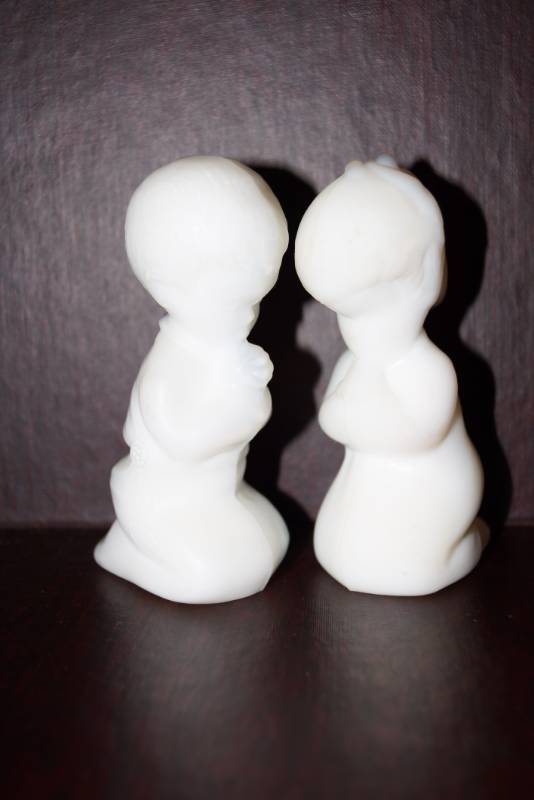 lot 514 image: Collectible Fenton Statues  Praying Boy & Girl  White Stone-like Satin Glass Figurines