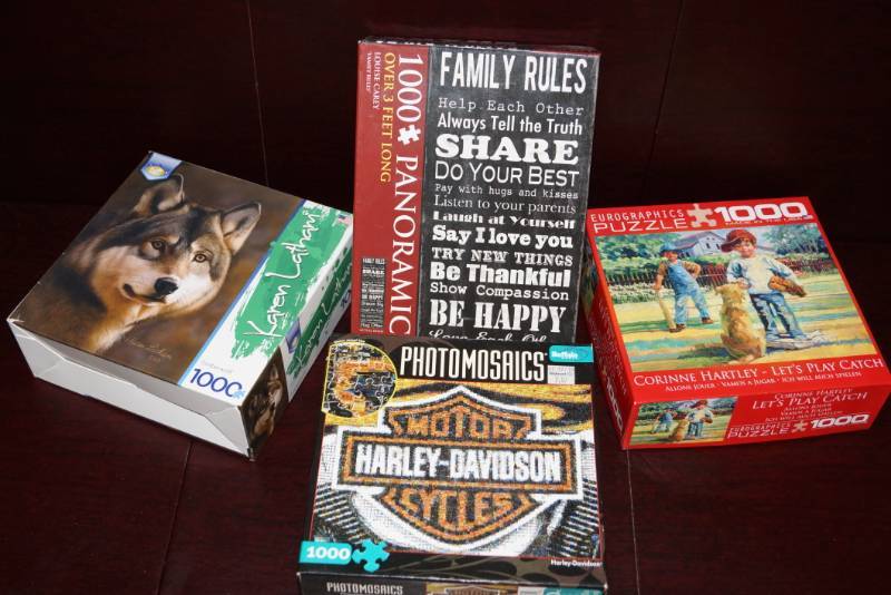 lot 579 image: Lot of 4  1,000 Piece Puzzles
