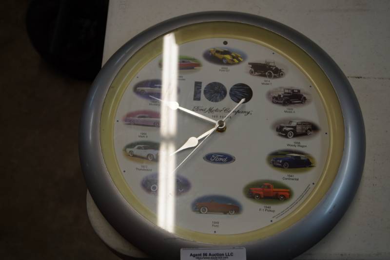 lot 64 image: Ford Motor Company Clock- 100 years-  Various Models Represented