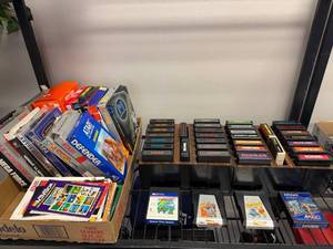 lot 801 image: Vintage Atari game cartridges and boxes with holders