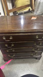 lot 956 image: Traditional Wood 4-Drawer side table with Handles 22x21x12 has stuck sticker on top