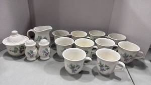 lot 1069 image: Pfaltzgraff tea cups with sugar and creamer bowl and salt and pepper shakers