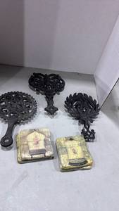 lot 1126 image: Cast Iron trivets and Birdcage Coasters
