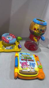 lot 1157 image: Baby Learning Toys Bundle - VTech Book, Fisher-Price Gumball & around town baby driver
