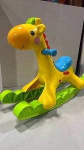 lot 1161 image: Fisher-Price RockinvTunes Giraffe one handle is broken 20 inches tall