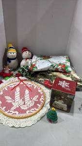 lot 1233 image: Snowman snow globe, stockings hanger, table clothes and more
