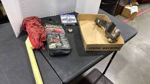 lot 1437 image: Trailer hitch with ball, lug nuts, small oil dispenser and car duster