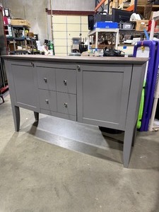 lot 990 image: Gray buffet sideboard table featuring two cabinets and four central drawers 37 x 58 x 19 in (top needs some attention)