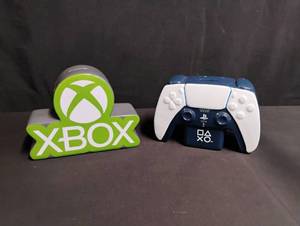 lot 1015 image: Gaming Controllers Coin Banks Set - Xbox and PS5