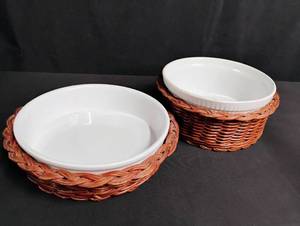 lot 1089 image: White Ceramic Baking Dishes with Woven Basket Holders