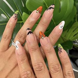 lot 64736 image: Halloween Press on Nails Medium Almond Fake Nails with Ghost Bat Spider Web French Tip Designs Halloween Nails Press ons Acrylic Stick on Nails for Women 24Pcs