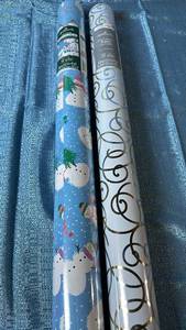 lot 2054 image: Hallmark Wrapping Paper. Includes One Heavyweight Foil Gift Wrap 170sqft. One Two-Sided Heavyweight Gift Wrap 300sqft.