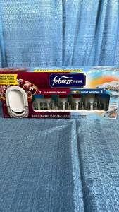 lot 3014 image: Febreze Plug Holiday Scents Set with Warmer