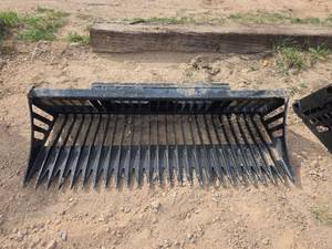 lot 4255 image: Wolverine Rock Bucket M-SB42 Mini Skid Steer Attachment