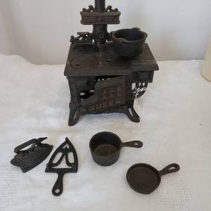 lot 5042 image: Cast Iron Queen Mini Stove with Accessories