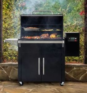 lot 1005 image: Traeger Silverton Wood Pellet Grill. WiFire. It is used but I tested it and it appears to work and auger runs with igniter got hot like it is supposed to. - Retail $1,399