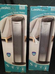lot 1095 image: (Set of 2) Lasko Oscillating Digital Ceramic Tower Heater for Home with Adjustable Thermostat, Timer and Remote Control, 23 Inches, 1500W, SilverBlack - Retail $150