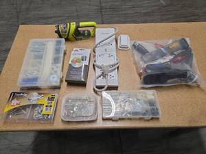 lot 9708 image: Assorted Tool and Hardware Lot with Ryobi Flash Light, Belkin Power Strip, and Accessories