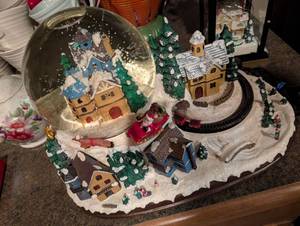 lot 208 image: Christmas Snow Globe Village with Moving Train Set