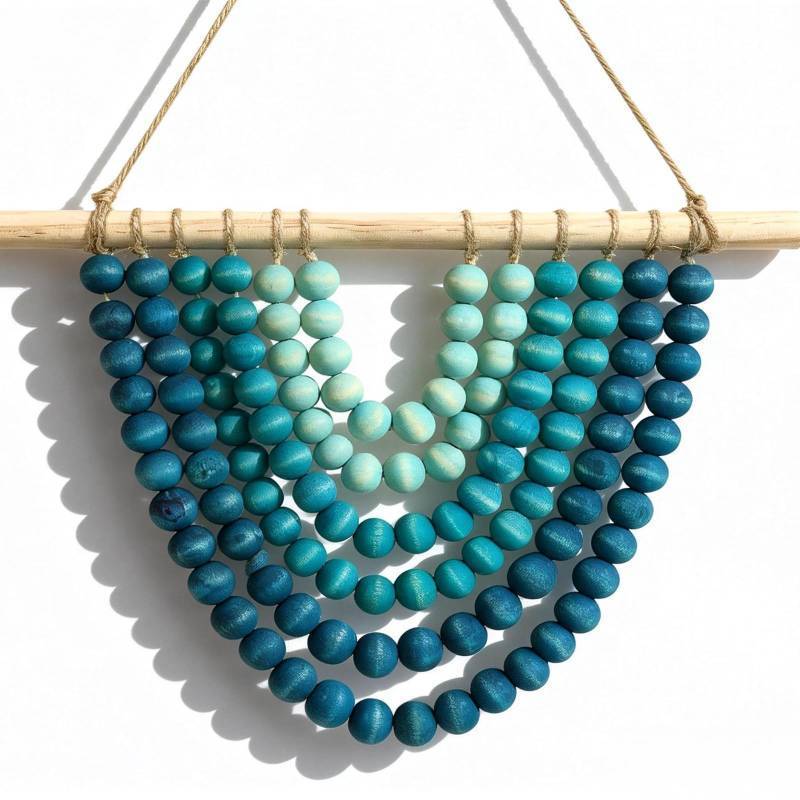 lot 41219 image: Boho Chic Wooden Bead Garland Wall Hanging Tapestry, Handcrafted Home Decor Inspired by Nature, Suitable for Living Room, Bedroom, Entryway, Nursery, Apartment & Dorm (Coastal Breeze Ombre, 12 inches) - Retail $15