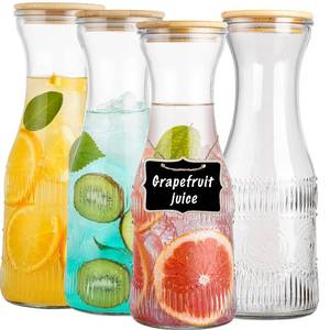 lot 62534 image: wookgreat Glass Carafe Pitchers with Lids, Set of 4 1 Liter Embossed Designed Beverage Pitcher Carafe Set for Mimosa Bar, Juice Container for Brunch, Cold Water, Juice -With 4 Wooden Chalkboard Tags - Retail $26