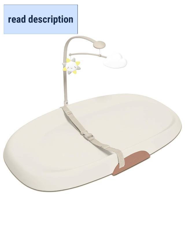 lot 351585 image: Retails for $143 Skip Hop Baby Changing Pad Nursery Style Wipe-Clean Contoured with Cushioned Foam, Non-Skid Base, Built-in Safety Belt & Tuck-Away Toy Bar, Oat