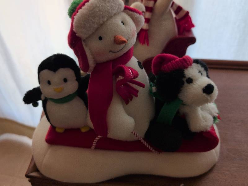 lot 2648 image: Animated Holiday Plush Sleigh with Snowman, Penguin and Puppy