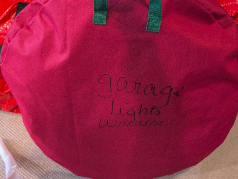lot 2672 image: Holiday Lights Wreath Storage Bag full of lighted wreaths