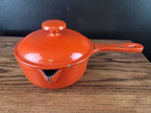 lot 3658 image: Orange Cast Iron Fondue Pot with Lid and Handle