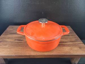 lot 3669 image: Orange Cast Iron Dutch Oven with Lid and Cooking Rack