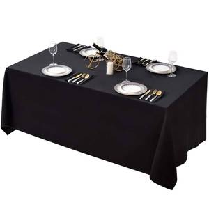 lot 45376 image: Black Tablecloth 90 x 132-inch Rectangular Polyester Table Cloth for Weddings, Banquets, or Restaurants - Retail $16