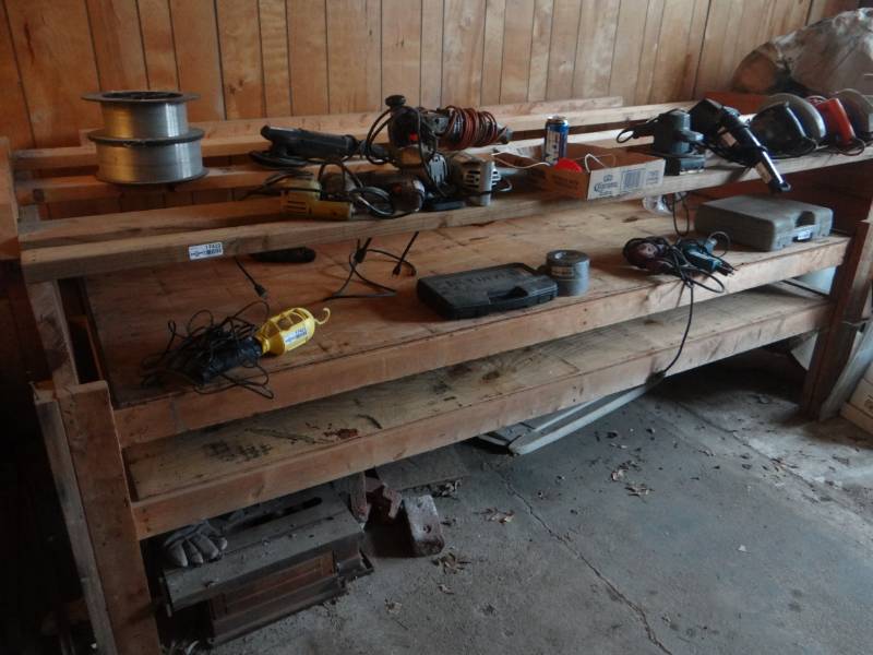lot 17432 image: Large wooden work table, contents not included.