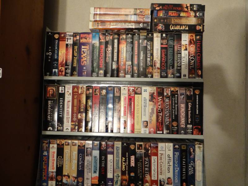 lot 17548 image: Lot of vhs & homemade stand.
