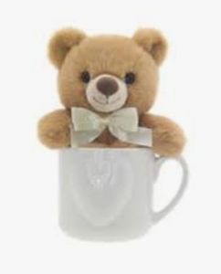 lot 15617 image: Small Teddy Bear in White Ceramic Mug with Bow
