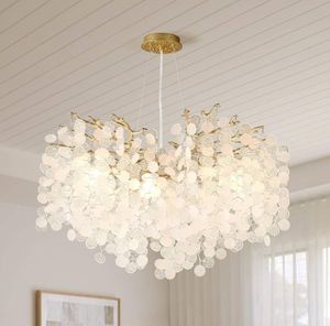 lot 15783 image: VBKK 24-Inch Capiz Shell Chandelier, 8-Light Gold Coastal Chandelier, Modern Crystal Tree Branch Chandeliers, Boho Light Fixture for Bedroom, Living Room, Foyer, Entryway, Stairwell - Retail $220