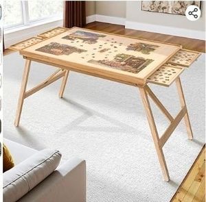 lot 35183 image: 27.6 H Tall 1500 Piece Puzzle Table with Legs, 4 Drawers, 34.3 W x 26.5 D Large Wood Folding Jigsaw Puzzle Board with Cover for Adults, Nature - Retail $85