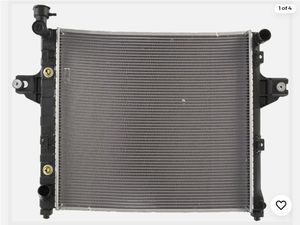 lot 35444 image: Genuine Agility Radiator 8012262 for 19992004 Jeep Grand Cherokee models - Retail $176