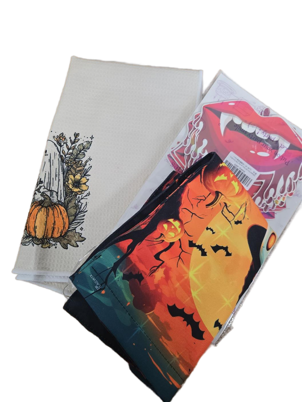 lot 9539 image: Halloween Bundle Set, Ghost Towel, Ghost Light-Up Flag, and Vampire Fangs Decor