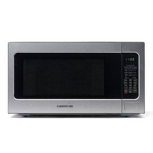 lot 33573 image: Farberware Countertop Microwave Ov 1100 Watts  2.2 cu ft - Smart Sensor With LED Lighting and Child Lock - Perfect for Apartments and Dorms - Easy Clean Black Interior  Stainless Steel - Retail $121