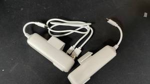 lot 10001 image: Nintendo Wii Nunchuk Controllers with Cables