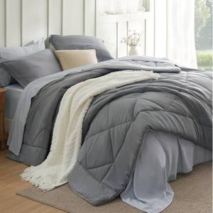 lot 1420 image: Bedsure Full Size Comforter Set - 7 Pieces Reversible Grey Bedding, Full Size Bed Set for All Seasons, Bed in a Bag with Down Alternative Comforter, Sheets, Pillowcases & Shams