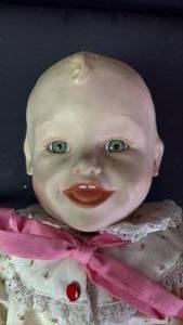 lot 342 image: Numbered Yolanda Bello Porcelain Baby Doll Approximately 12 Inches