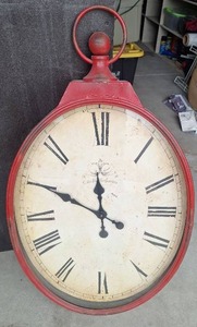 lot 102 image: Red Oval Wall Clock with Roman Numerals and Handle