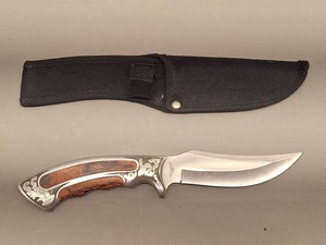 lot 52 image: Ridge Runner Decorative Fixed Blade Knife with Wood Handle and Nylon Sheath