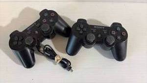 lot 406 image: PlayStation Wireless Controllers with Charging Cord.